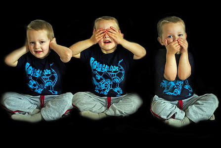 boy in black shirt and gray pants sitting thumbnail