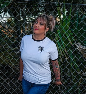 Photo of Woman Wearing White Ringer Tee and Blue Jeans thumbnail