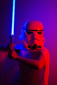 person holding lightsaber thumbnail