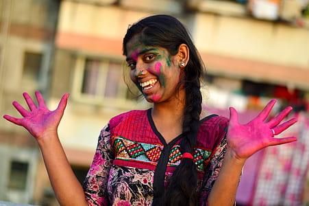 woman covered in pink holi powder in shallow-focus shot thumbnail