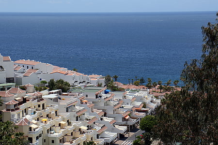 building along coast during daytime thumbnail