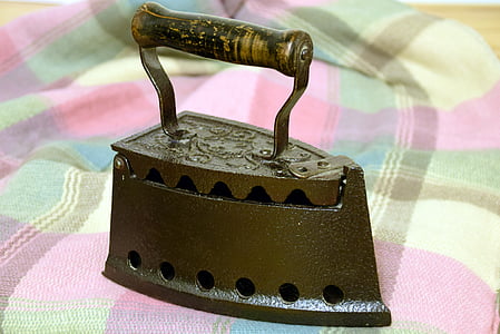 black steel charcoal iron on pink and yellow surface thumbnail