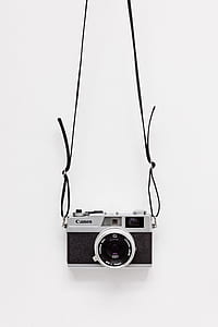 vintage gray and black Canon camera thumbnail