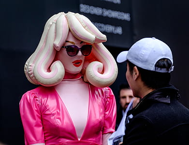 person staring at inflatable mannequin thumbnail