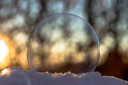 round clear glass on white surface close-up photography thumbnail