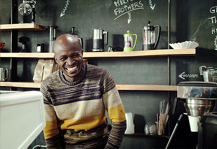 man wearing gray and white striped sweater thumbnail