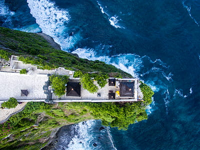 aerial photography of house near cliff thumbnail