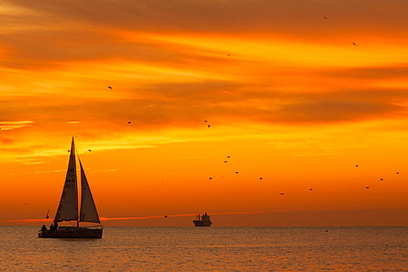 white sailboat during sunset thumbnail