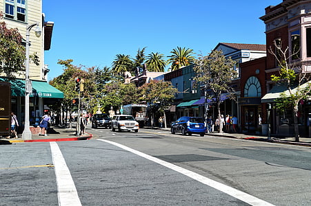 blue and white cars on gray concrete road thumbnail
