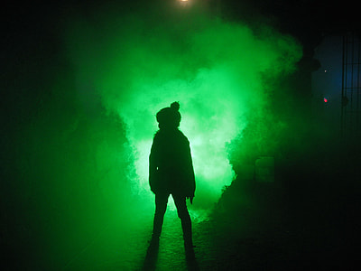 photo of person standing in front of green light thumbnail
