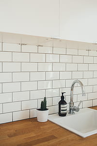 black pump bottle on kitchen sink thumbnail