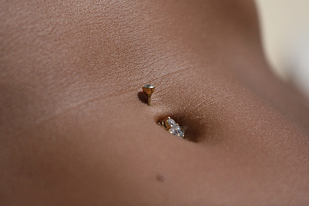 navel with gold piercing thumbnail