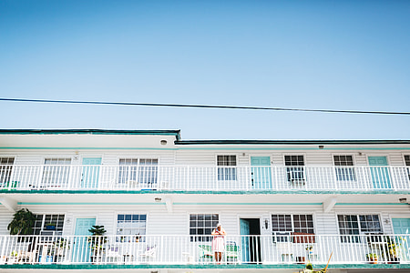 architectural photography of green and white house thumbnail