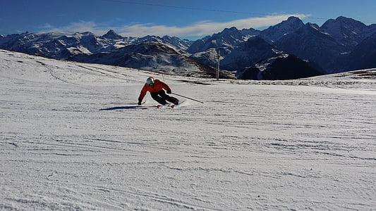 person riding on snowski during daytime photography thumbnail