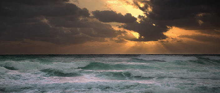 seawaves under cloudy sky during daytime thumbnail