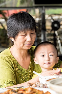 child near woman in green top thumbnail