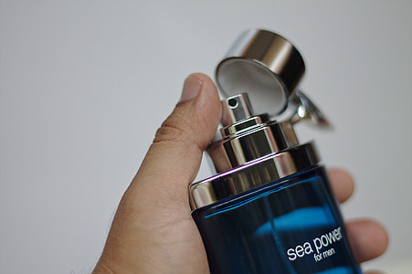 person holding Sea Power for men fragrance spray bottle thumbnail