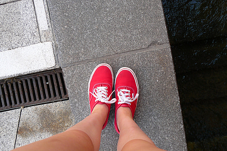 person wearing read sneakers thumbnail