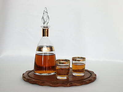 Clear Glass Decanter Beside Two Drinking Glasses thumbnail