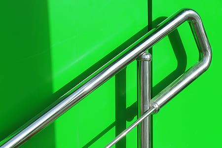 stainless steel frame on green wall thumbnail