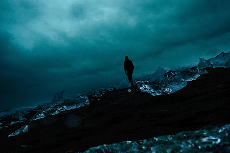 photo of man standing during nighttime thumbnail