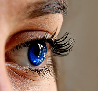 close-up photo of persons left blue eyes thumbnail