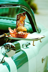 hamburger on orange plastic tray thumbnail