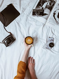 person holding brown ceramic mug thumbnail