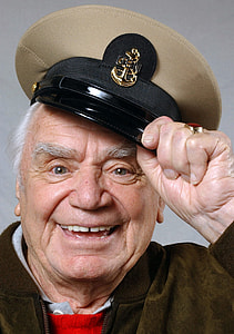 closeup photo of man holding captains cap thumbnail