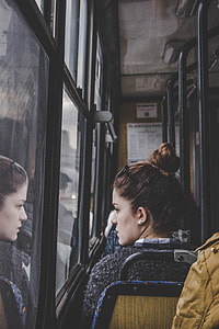 woman sitting near window thumbnail