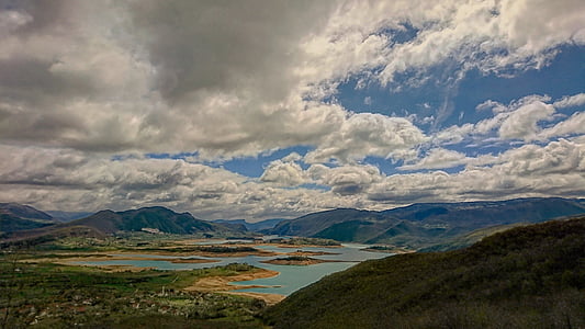mountain near body of water thumbnail