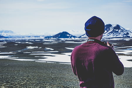 man holding DSLR thumbnail