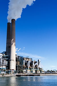 factory beside body of water thumbnail