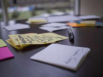 assorted color sticky notes on brown wooden table thumbnail