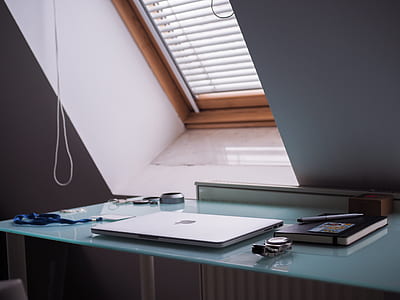 MacBook beside watch and book thumbnail