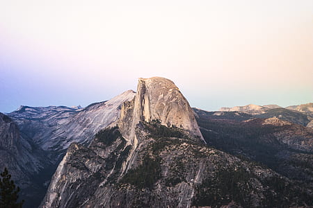 aerial view of mountains under bright sky thumbnail
