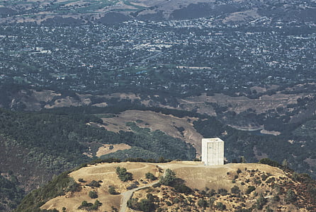aerial photography of white building on hill thumbnail