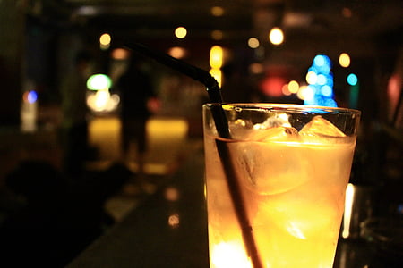 yellow liquid in cup with straw thumbnail