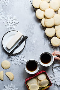 dough near two white ceramic teacups thumbnail