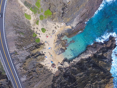 aerial photo of people on beach during daytime thumbnail
