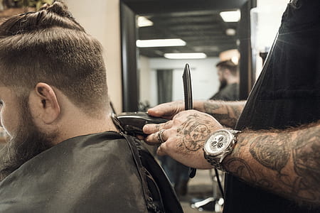 man clipping hair beside mirror thumbnail