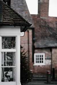 selective focus photography of windowpane wall house thumbnail