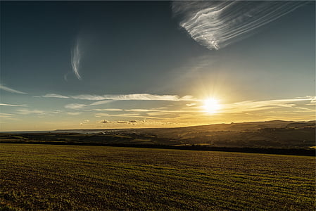 green landscape under blue sky at daytime thumbnail