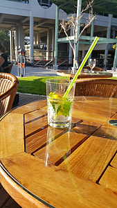 clear drinking glass on brown wooden table thumbnail