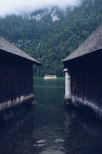 white and brown passenger boat near mountain thumbnail