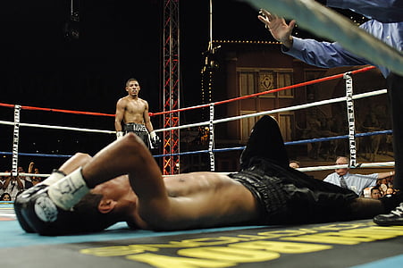 man lying on boxing ring thumbnail
