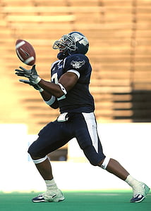 person playing football on field thumbnail