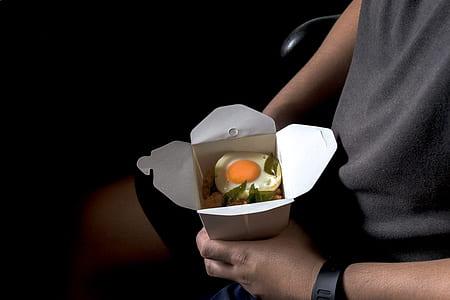 person holding a bowl on fried rice with egg thumbnail
