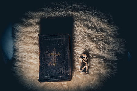 bible on white textile thumbnail