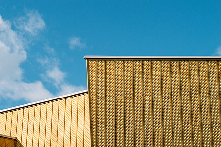 brown building under blue sky low-angle photography thumbnail